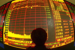 WUHAN, CHINA - MAY 28: (CHINA OUT) An investor views stock prices on monitors at a securities company on May 28, 2007 in Wuhan of Hubei Province, China. Chinese stocks hit new highs today with the benchmark Shanghai Composite Index closing at 4,272.11 points, up 2.21 percent, as the total number of share trading accounts in the country topped 100 million. In the last two weeks, the China Securities Regulatory Commission (CSRC) have issued a second warning for securities firms and related authorities to educate individual investors on risks associated with the booming Chinese stock market.  (Photo by China Photos/Getty Images)