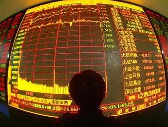WUHAN, CHINA - MAY 28: (CHINA OUT) An investor views stock prices on monitors at a securities company on May 28, 2007 in Wuhan of Hubei Province, China. Chinese stocks hit new highs today with the benchmark Shanghai Composite Index closing at 4,272.11 points, up 2.21 percent, as the total number of share trading accounts in the country topped 100 million. In the last two weeks, the China Securities Regulatory Commission (CSRC) have issued a second warning for securities firms and related authorities to educate individual investors on risks associated with the booming Chinese stock market.  (Photo by China Photos/Getty Images)