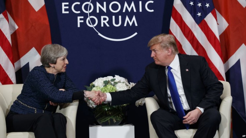 President Donald Trump meets with British Prime Minister Theresa May at the World Economic Forum, Thursday, Jan. 25, 2018, in Davos. (AP Photo/Evan Vucci)